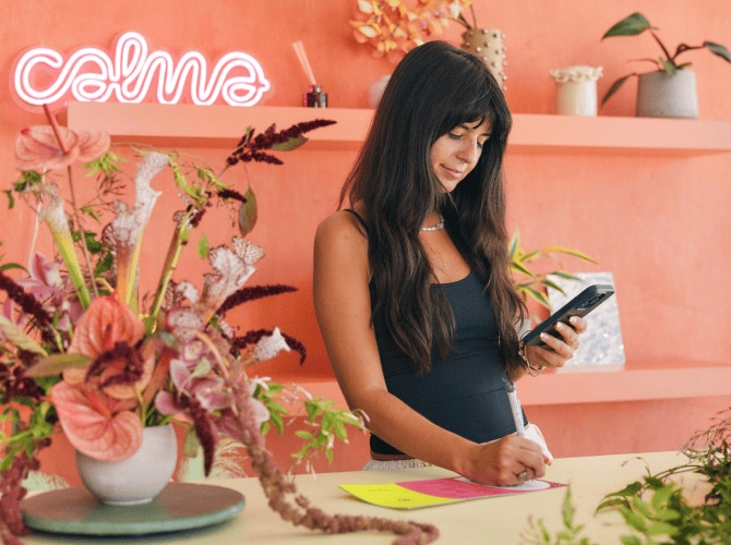 TurboTax customer Elizabeth looks down at her smartphone.