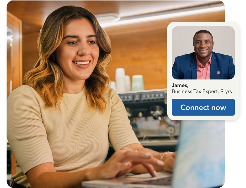 TurboTax customer Carina is seated with her laptop open, shown on a one-way video call with Business Tax Expert Tim. Tim has nine years of experience.