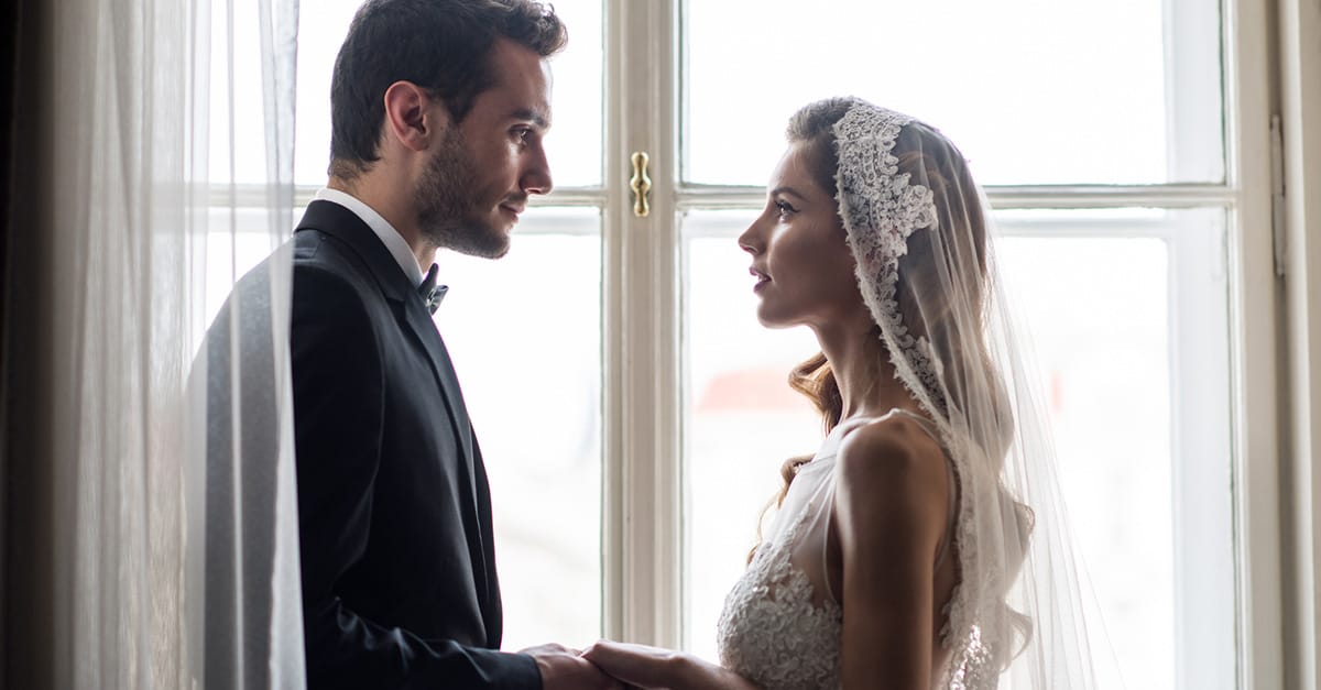 Bride and groom holding hands