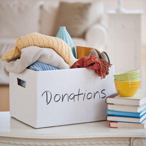 Overflowing donation box on table